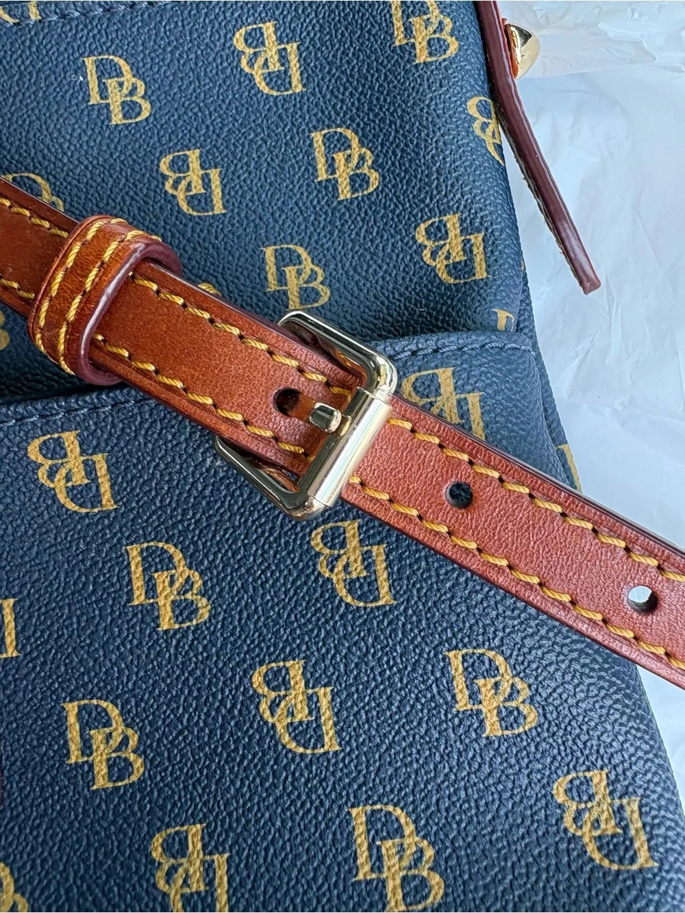 Dooney & Bourke navy with Brown Trim Monogram Crossbody